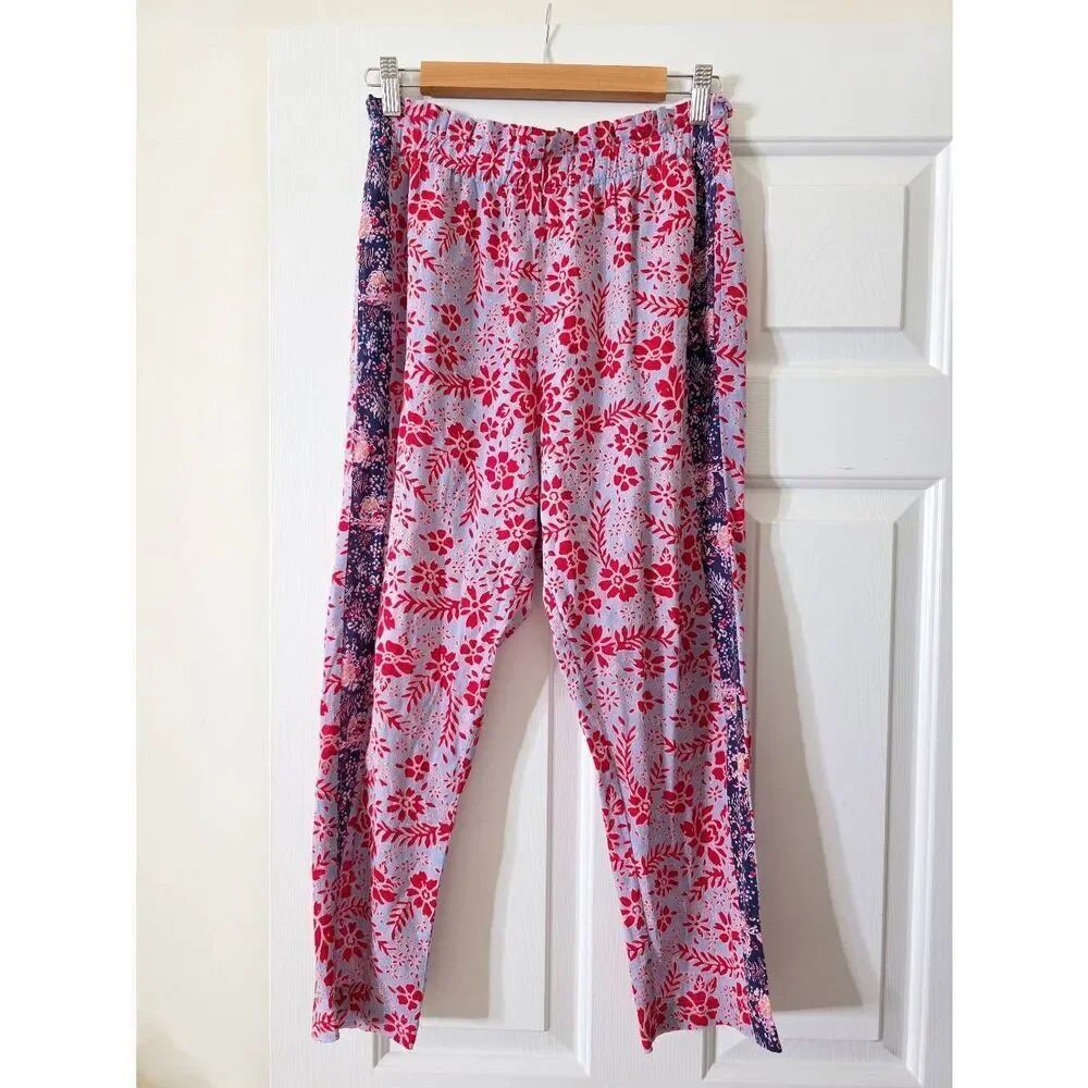 Xirena Payton Floral Pants in red and blue, a floral print and contrasting side